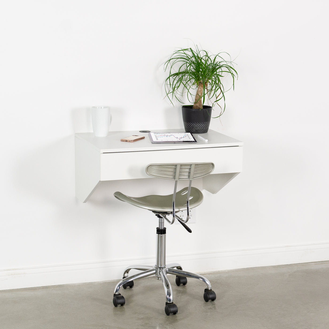 Sturdy wall mount desk with drawer for home or office.
