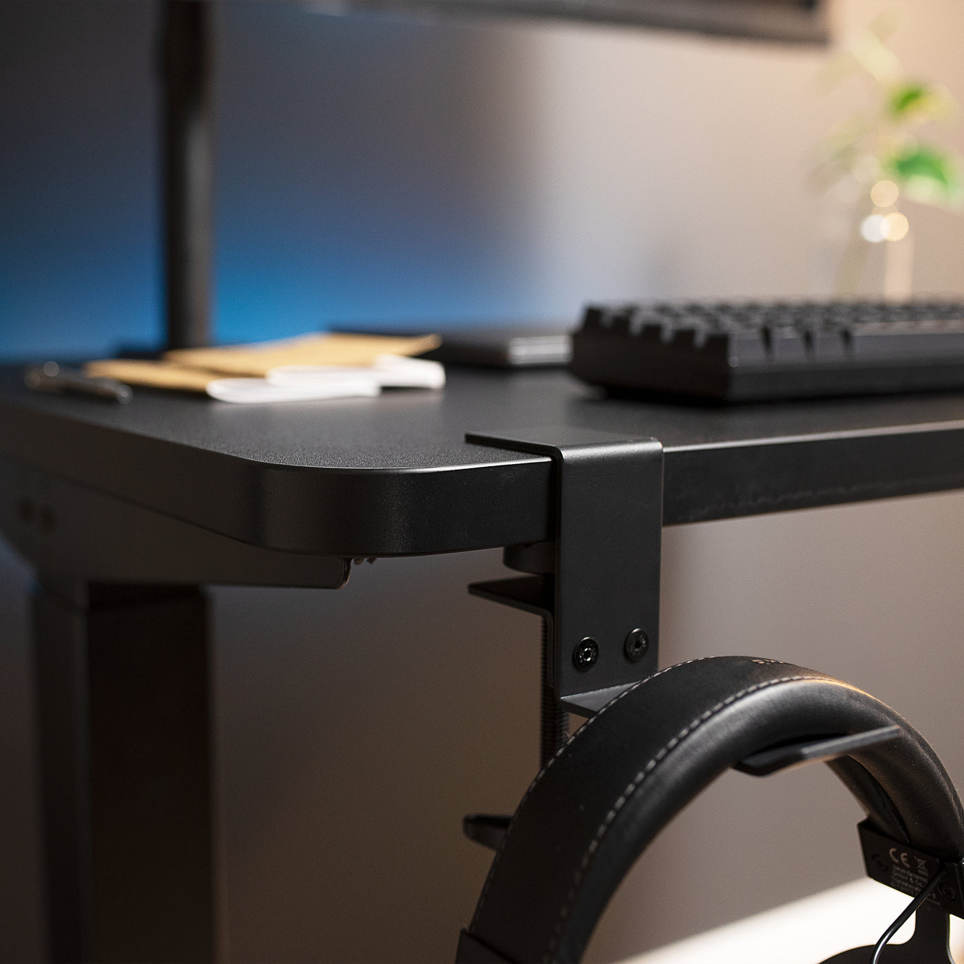 Thick desktop with a clamp-on headphone stand.