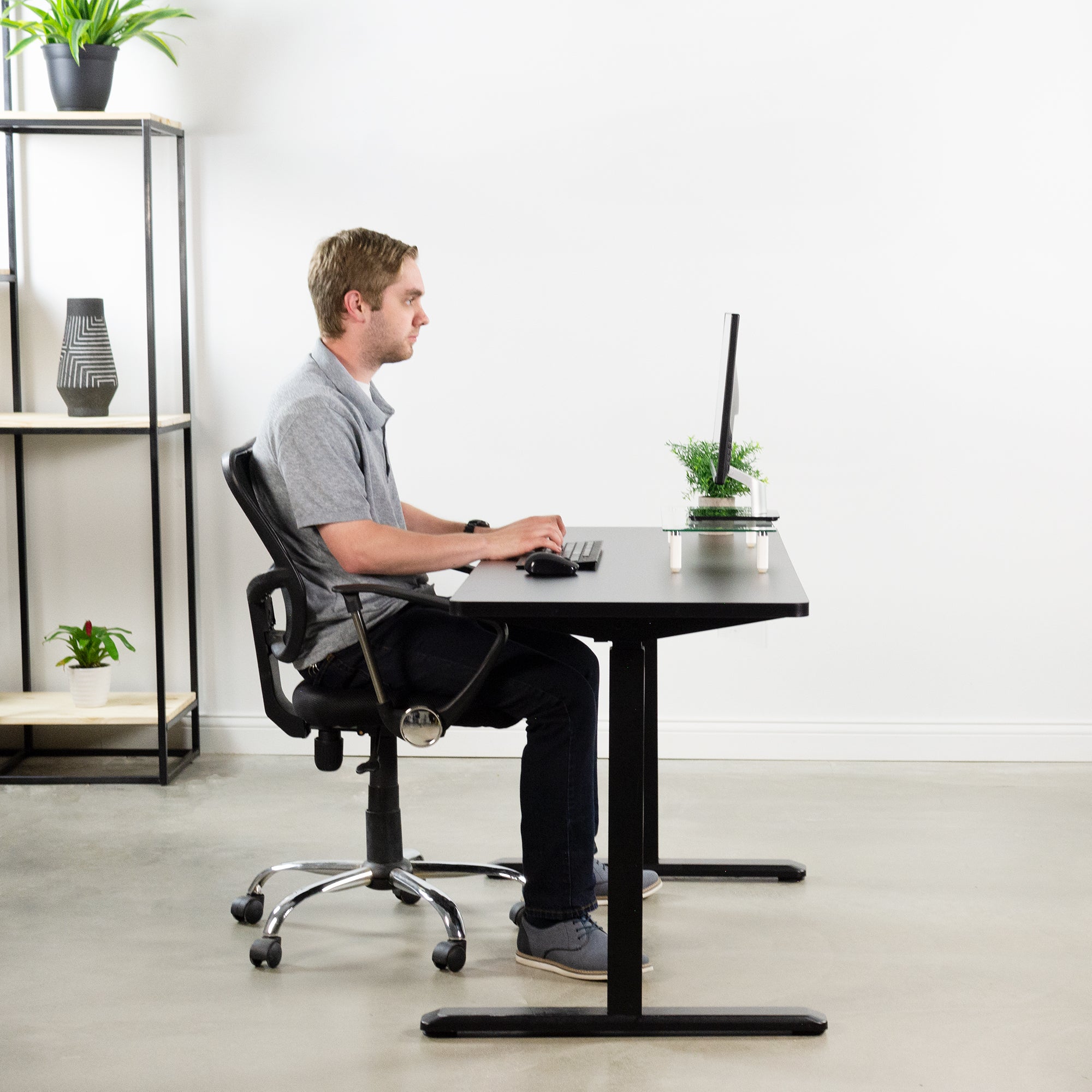 Electric desk with a matching laminated particleboard desktop.