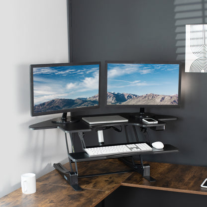 Heavy-duty height adjustable corner desk converter monitor riser with 2 tiers.