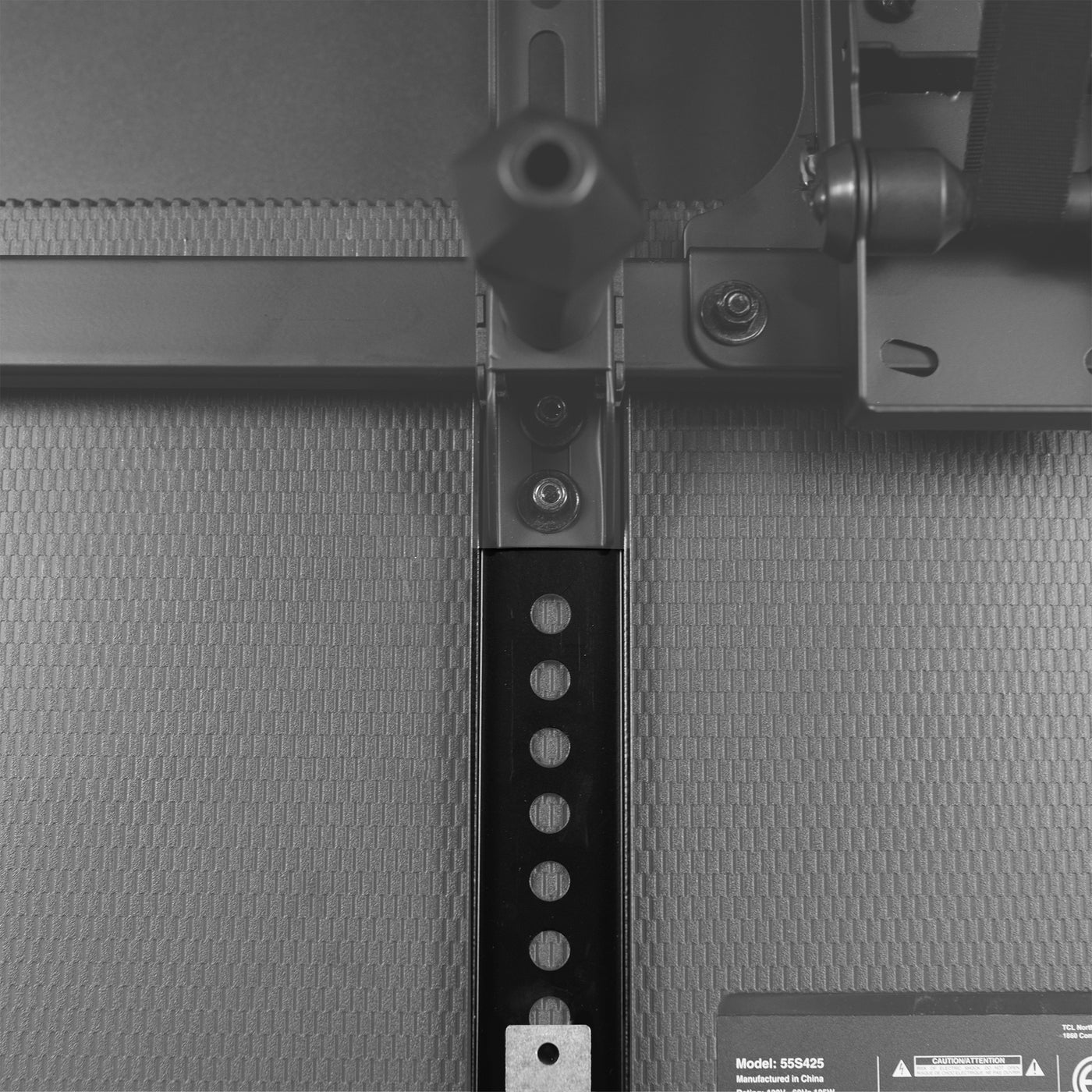 Close up of Vertical extension bracket for the back of a mounted TV.