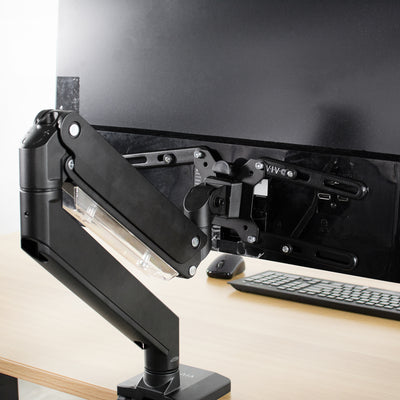 Sturdy support of VIVO LCD VESA screen adapters mounting a monitor in an office space.