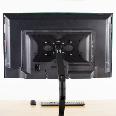 Attachment of a steel VESA plate attached to a flat-panel monitor.
