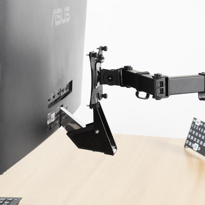ASUS monitor mount soundly elevating a monitor over a sit-to-stand desk.