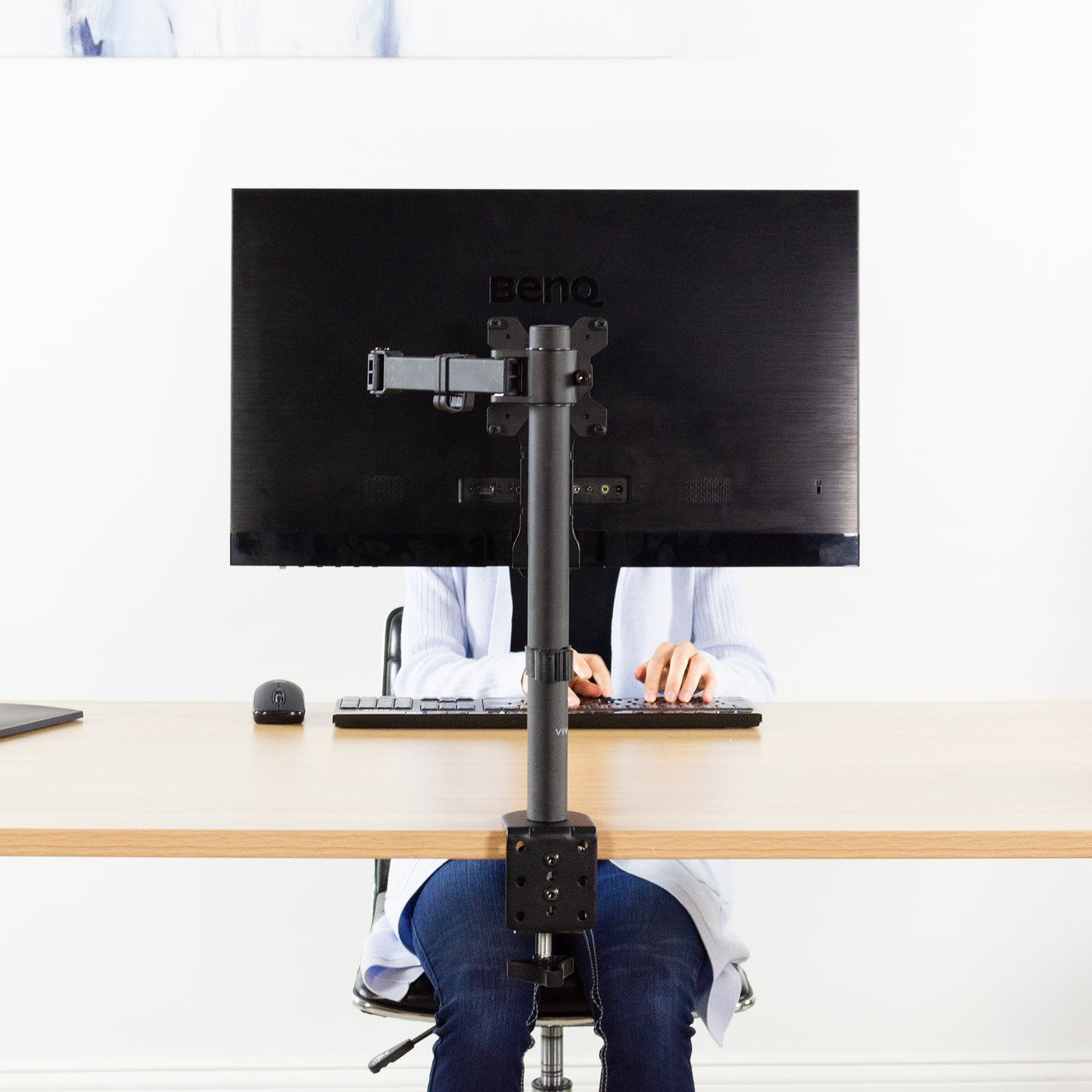 Securely support your large monitor above your desk to reduce neck strain.