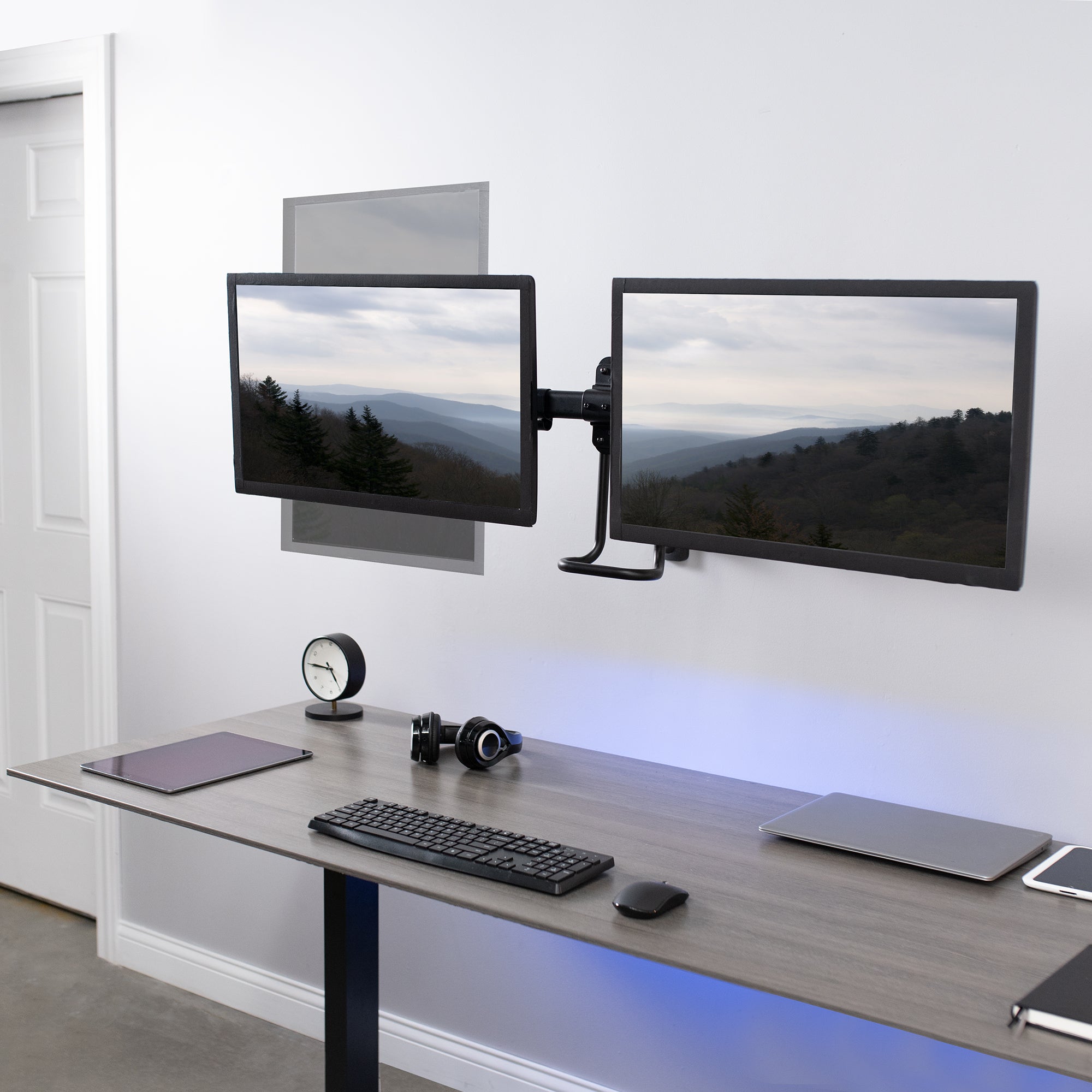 Dual Monitor Pneumatic Wall Mount for ergonomic viewing angles.