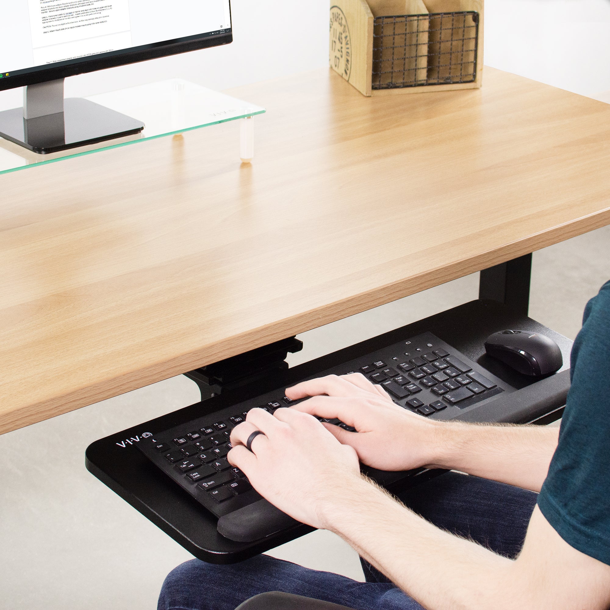 Typing on an under-desk pull-out keyboard tray.