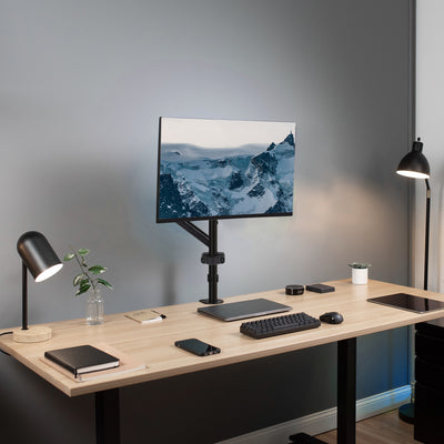 Modern office space utilizing a pneumatic pole monitor arm mount.