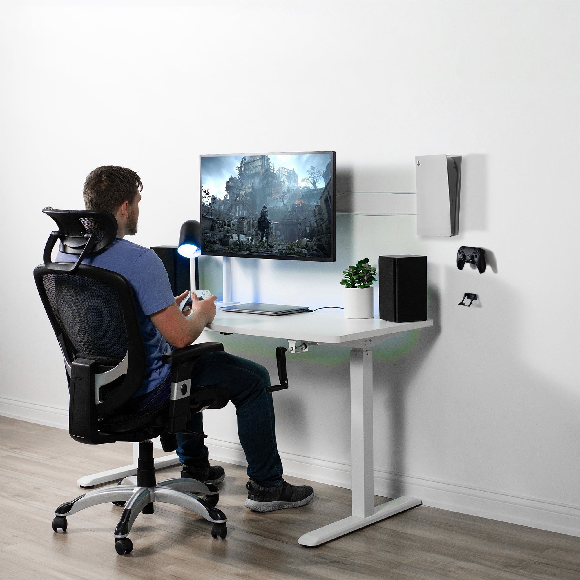 A man gaming with a PS5 and controllers mounted to the wall for convenience.