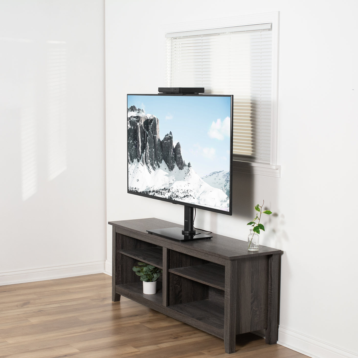 TV top shelf elevating a streaming device to a convenient height.
