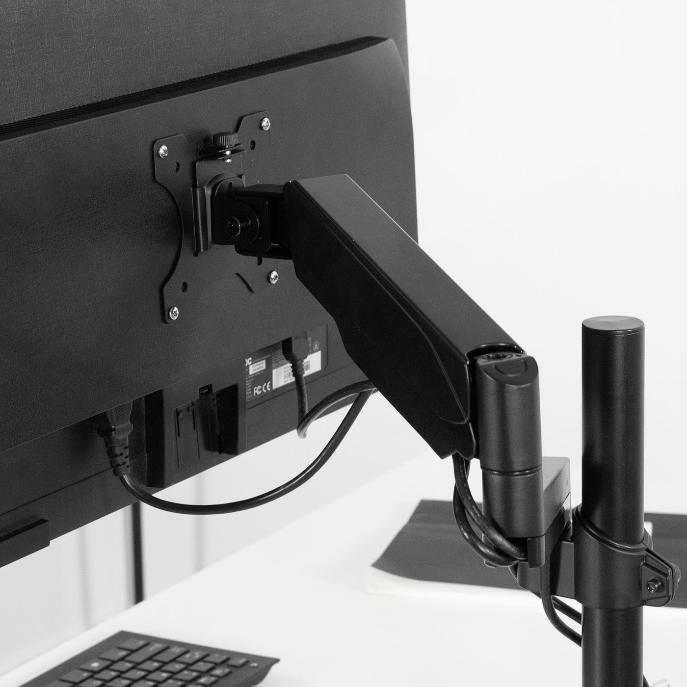 Pneumatic monitor mount arm for standard clamp on desk pole.