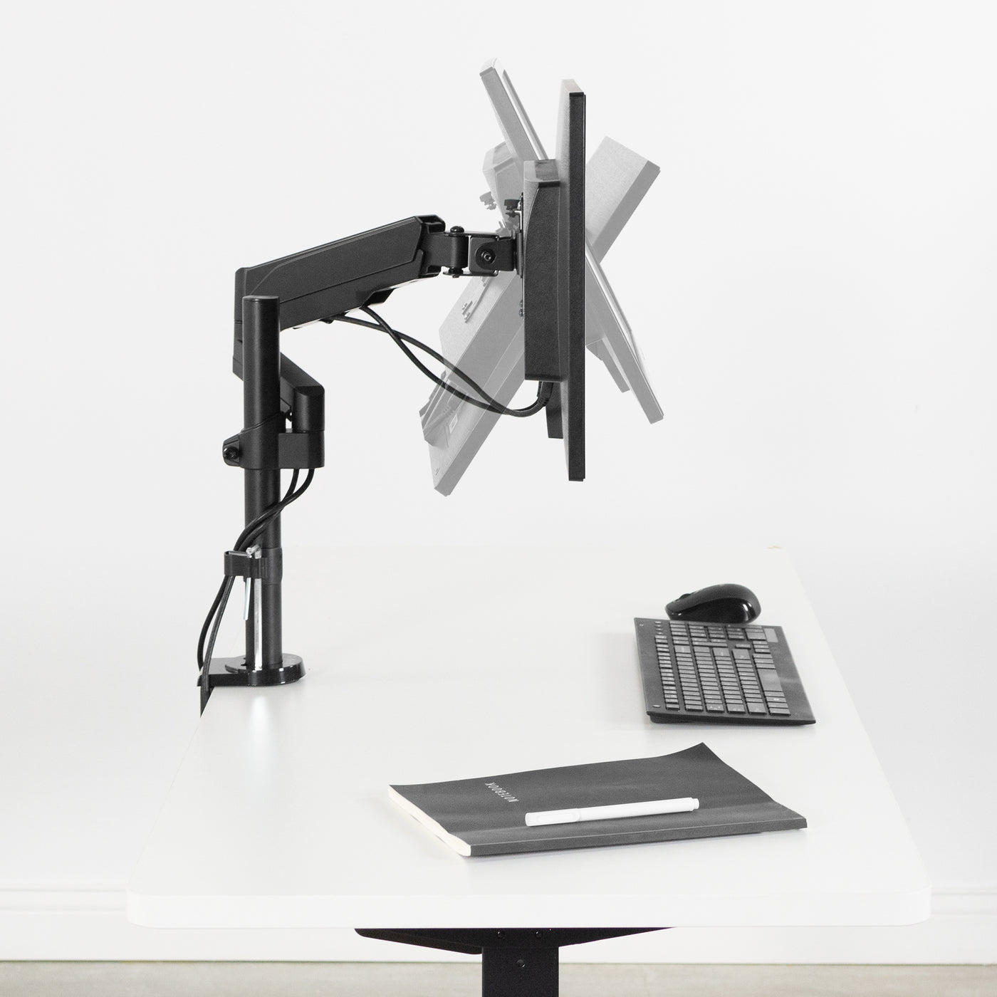 Articulation and adjustments of a pneumatic arm mounted to a clamp on a desk pole.
