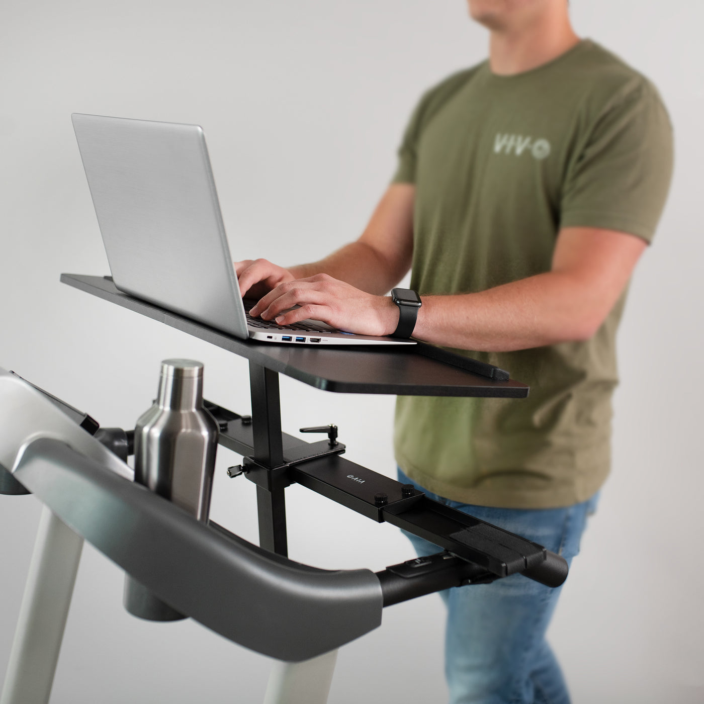 Height adjustable treadmill workstation in a work-from-home office.