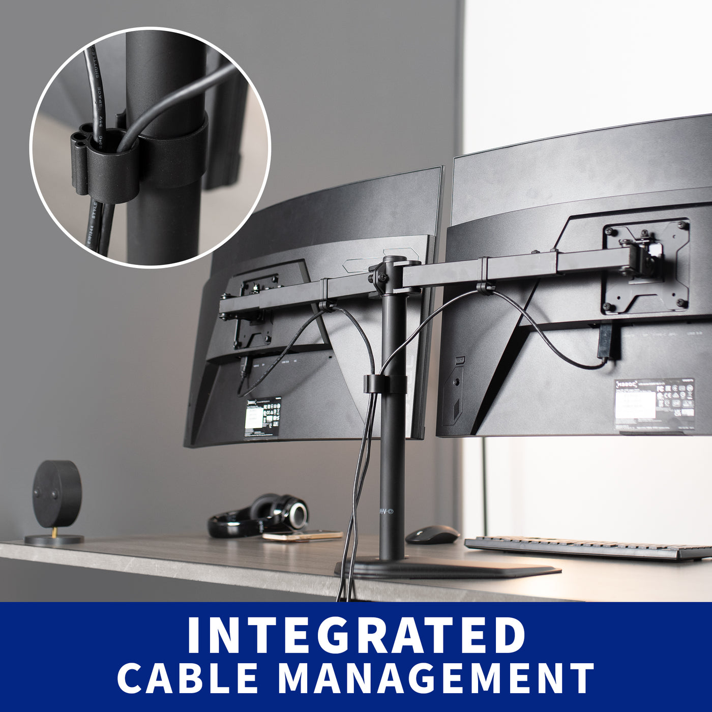 Integrated cable management on the dual monitor mount to maintain an organized workspace.