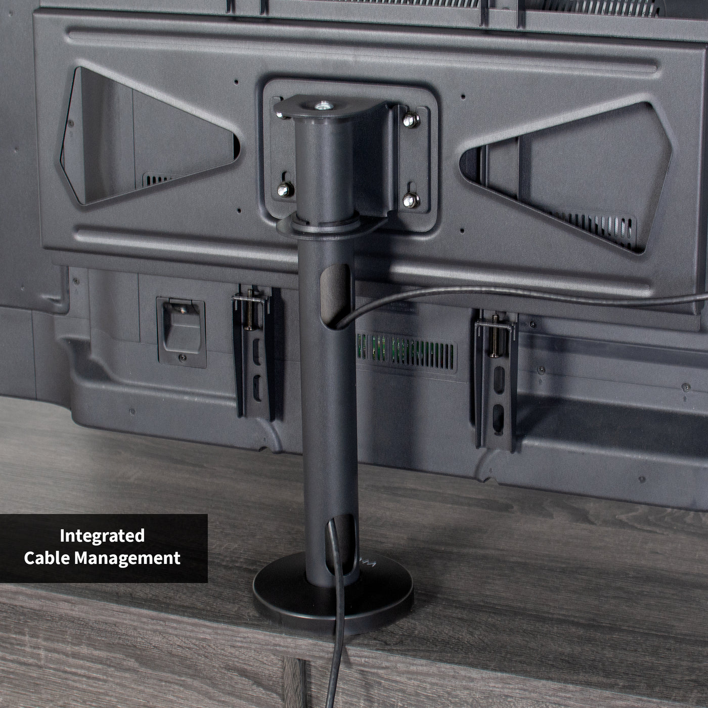 Sturdy bolt-down TV mount with cable management.