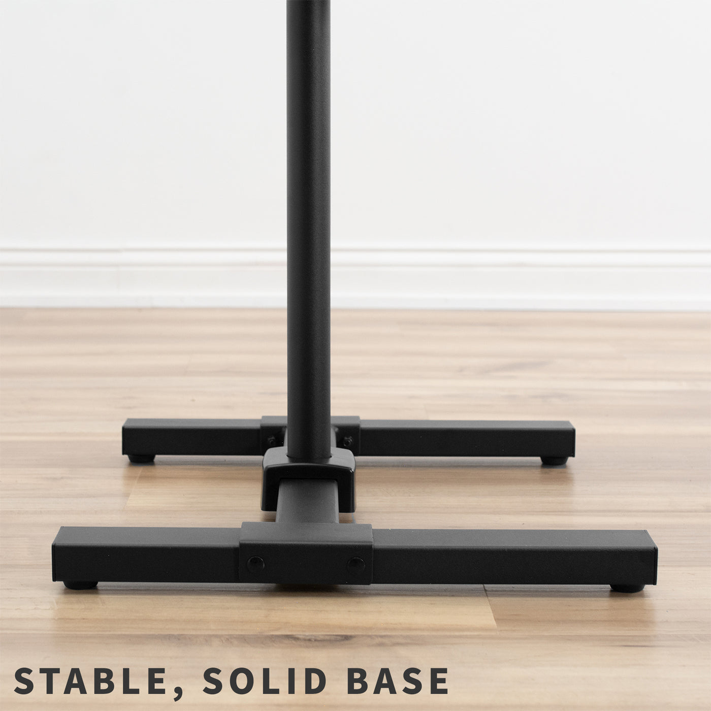 Sturdy height adjustable TV stand with utility shelf and solid stable base.