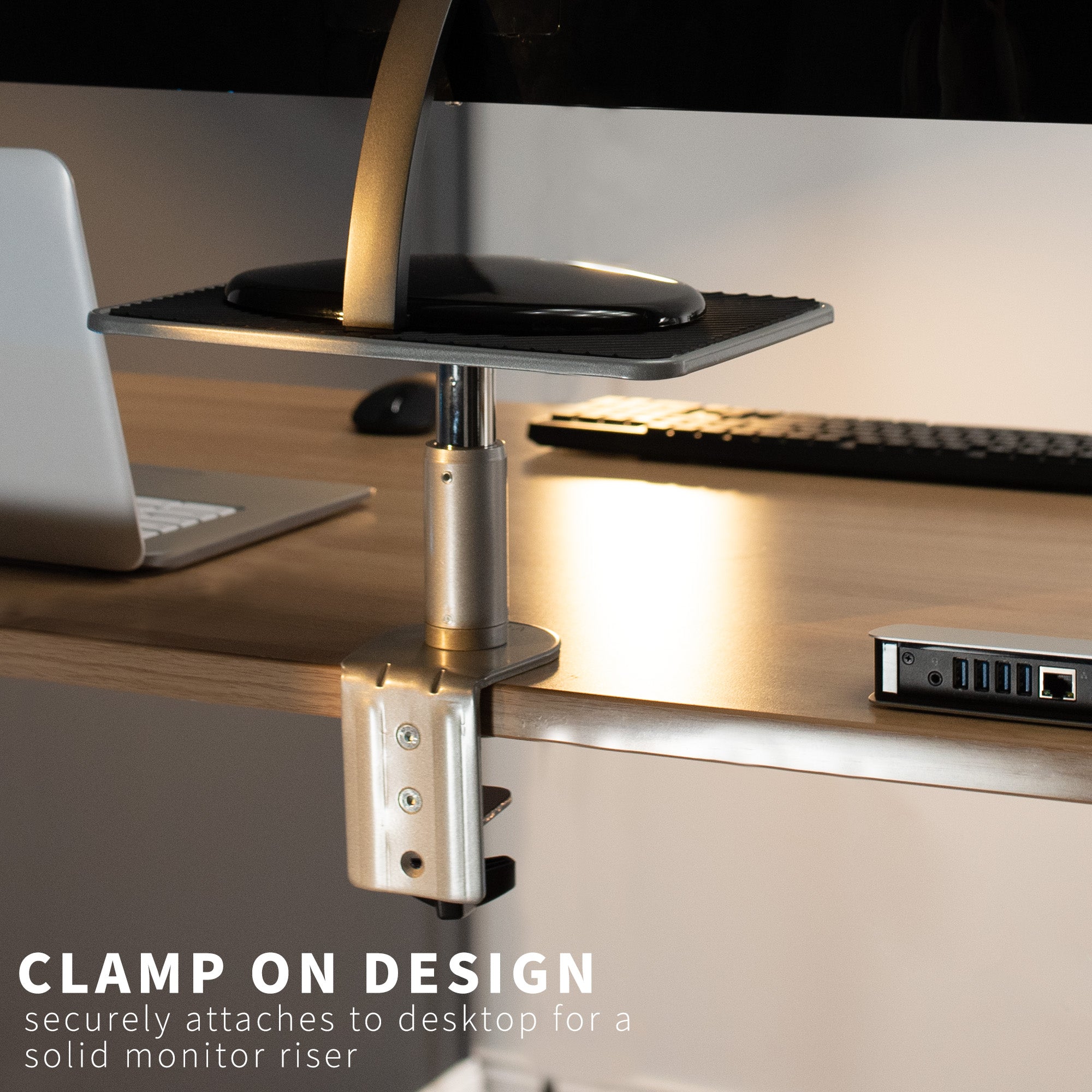 Secure clamp-on desk mount riser for laptop or monitor that provides ergonomic viewing and reduces strain.