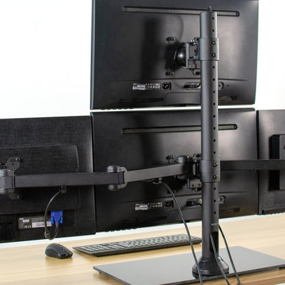 Sturdy height adjustable quad monitor desk stand.