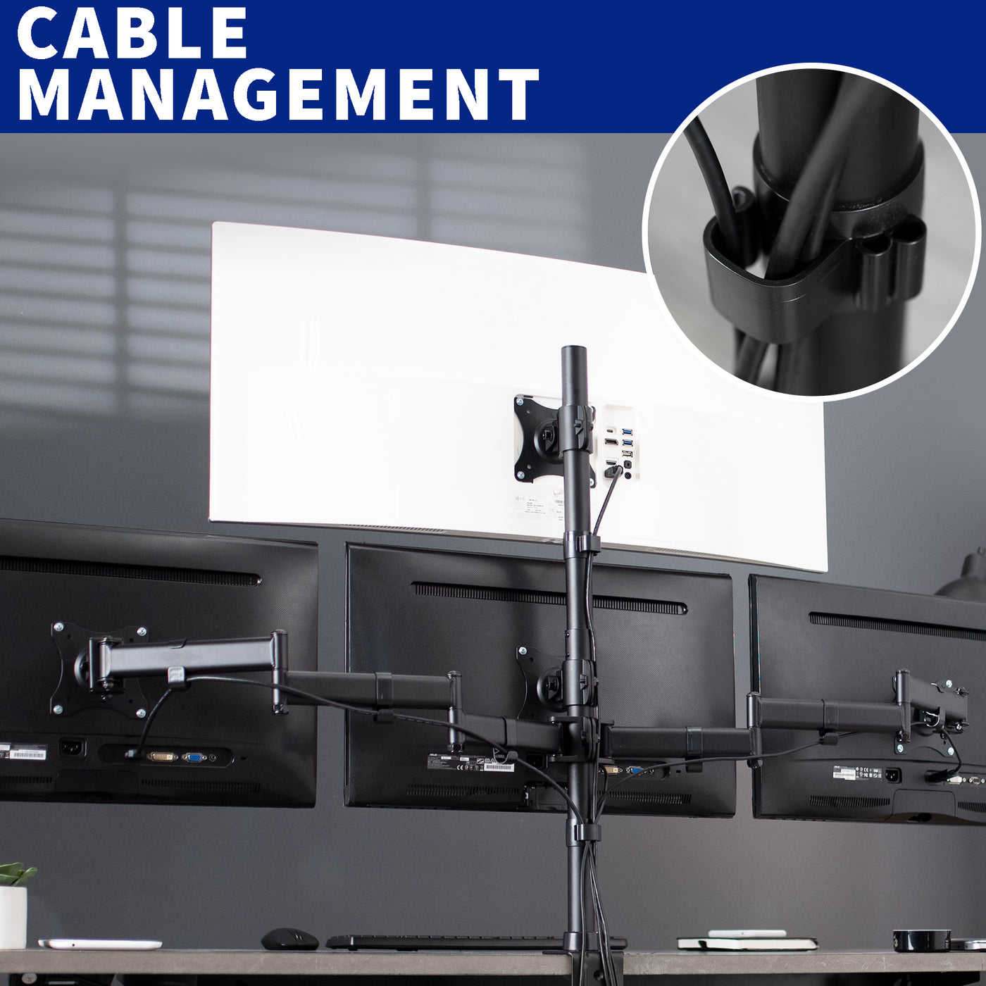Sturdy height adjustable quad monitor desk stand with cable management.