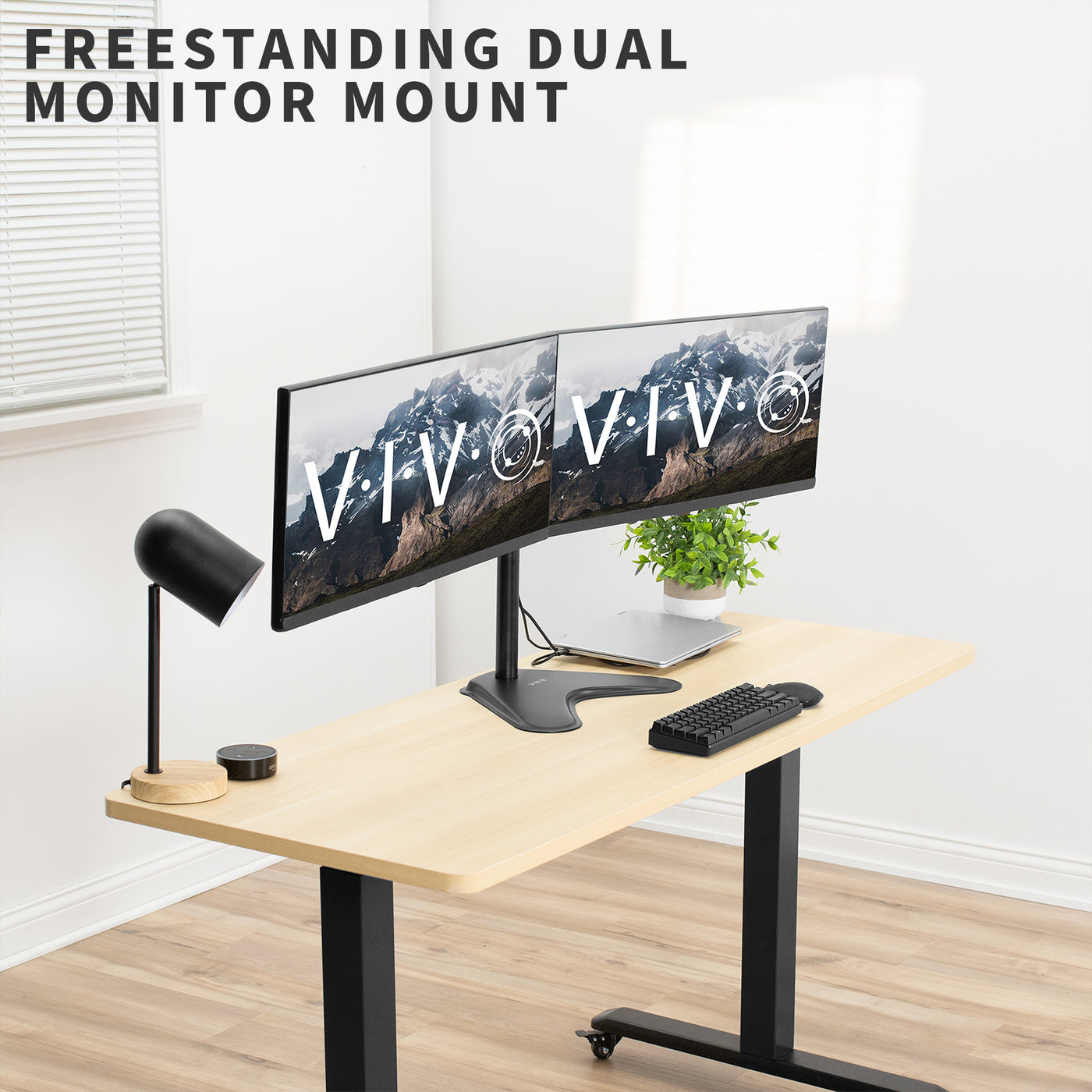 Freestanding adjustable dual monitor ergonomic desk mount for office workstation.