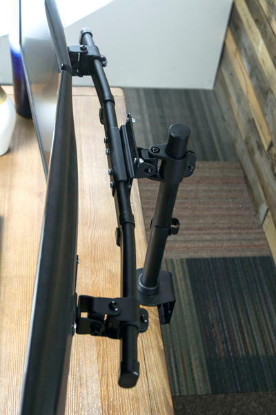 Sturdy dual monitor bracket mounted to a clamp on desk mount.