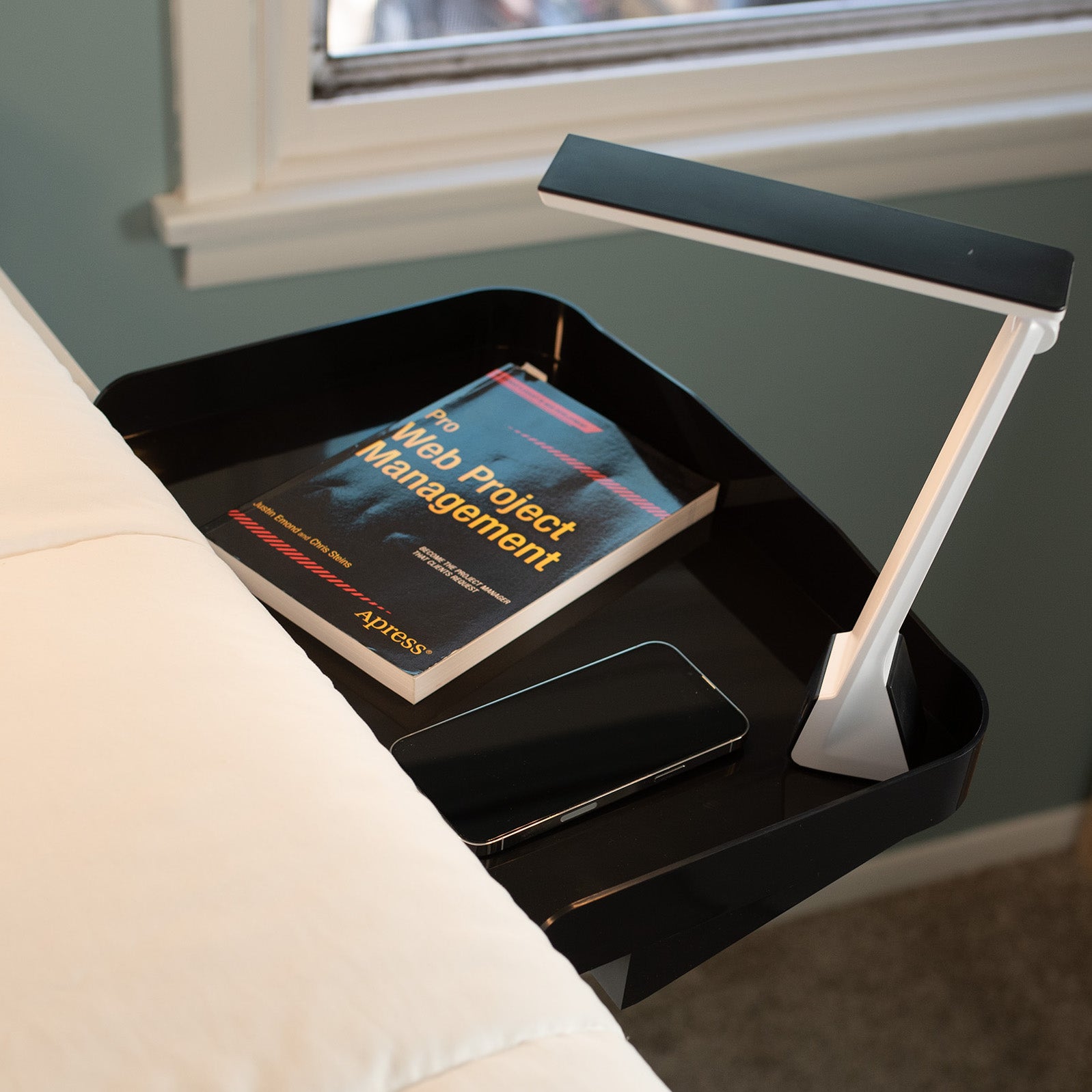 Attachable bedside shelf nightstand tray for storage and organizing.